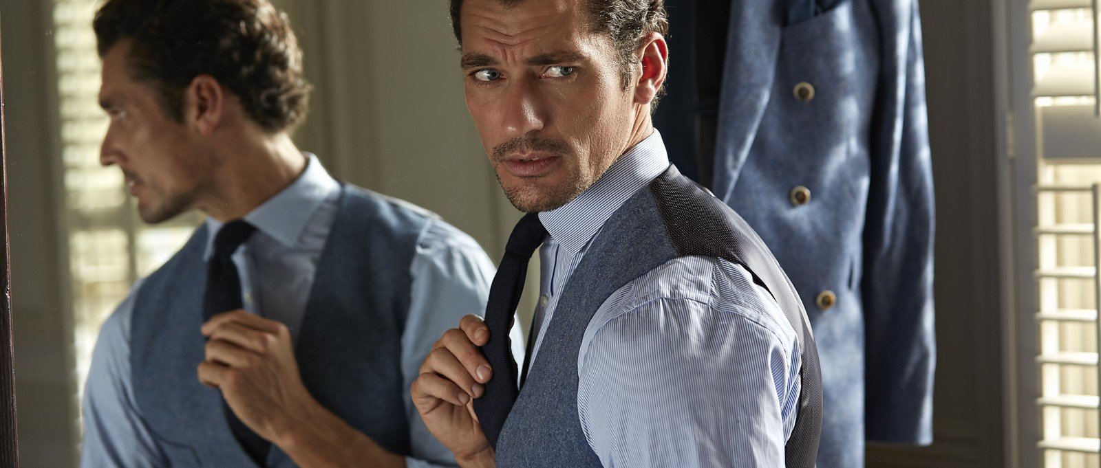 David Gandy tying his London Sock Company Tie in mirror