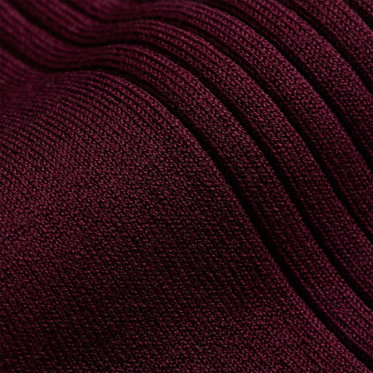 Close up of knee high burgundy socks