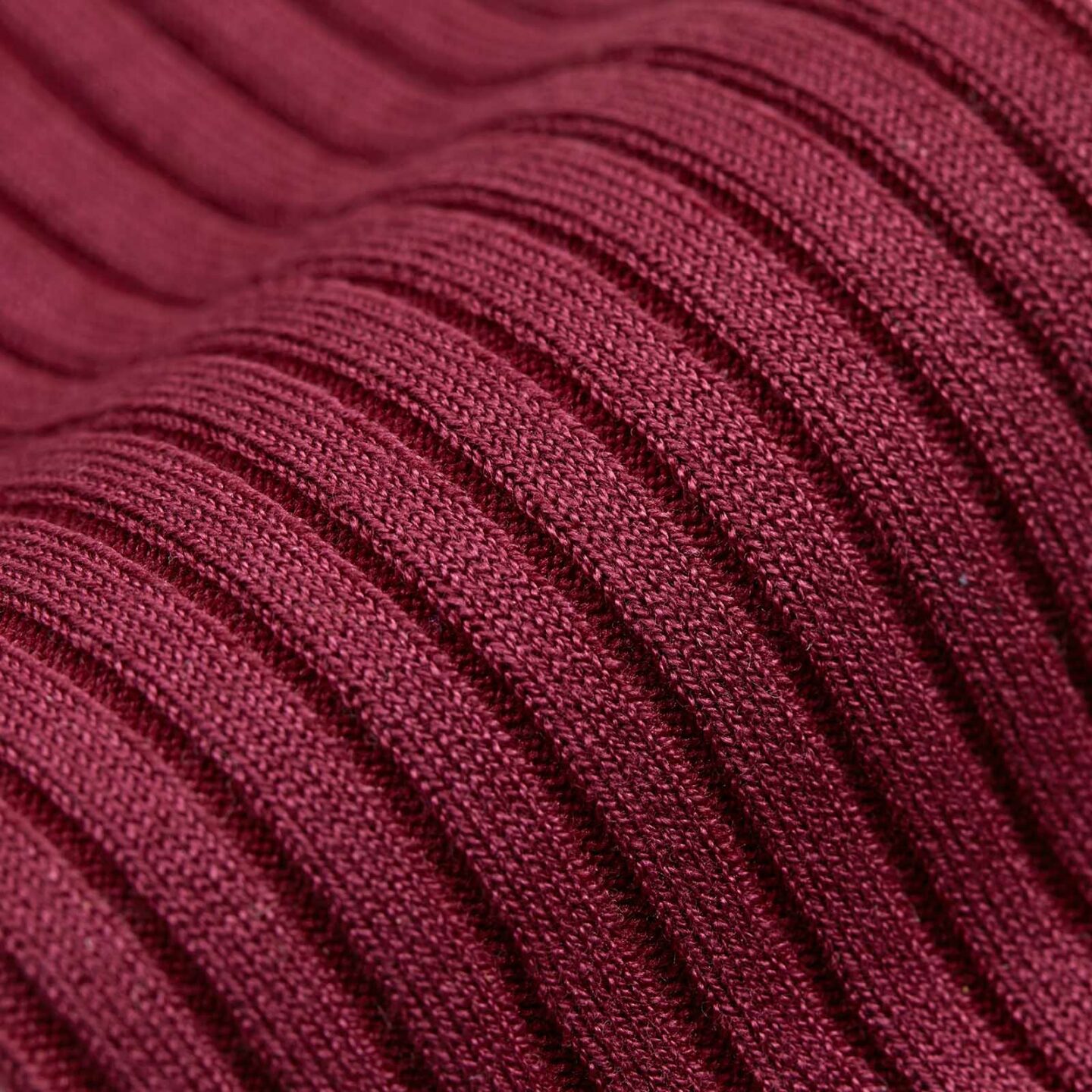 A close up of stripes on a red sock