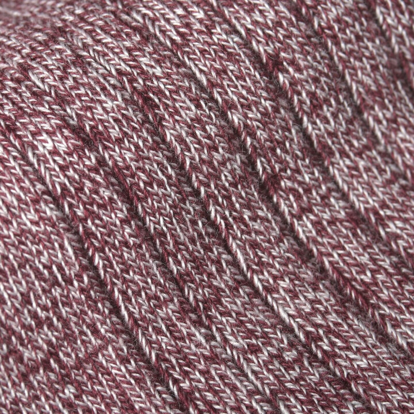 Close up of burgundy and white marl socks