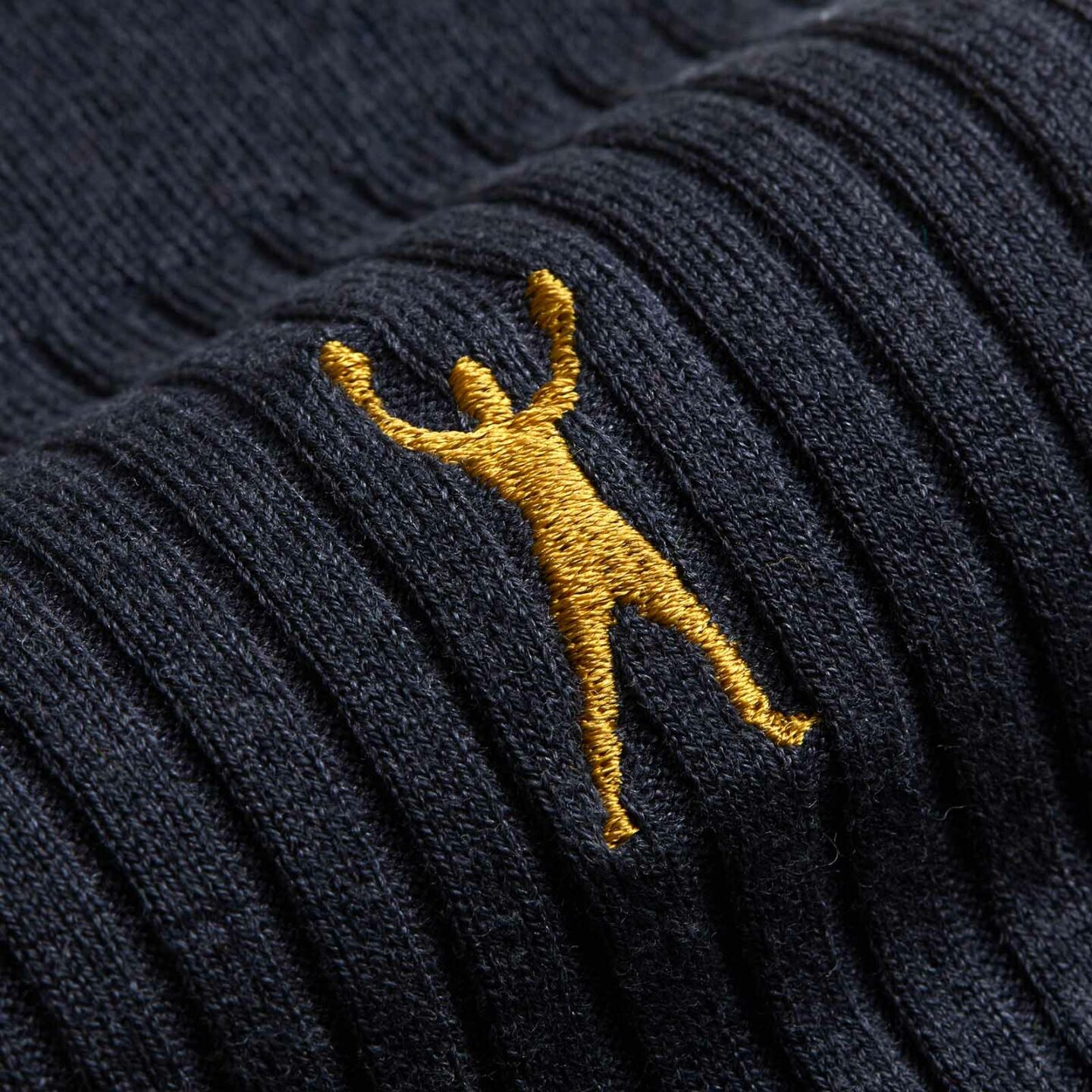 Close up of a yellow man on a black sock