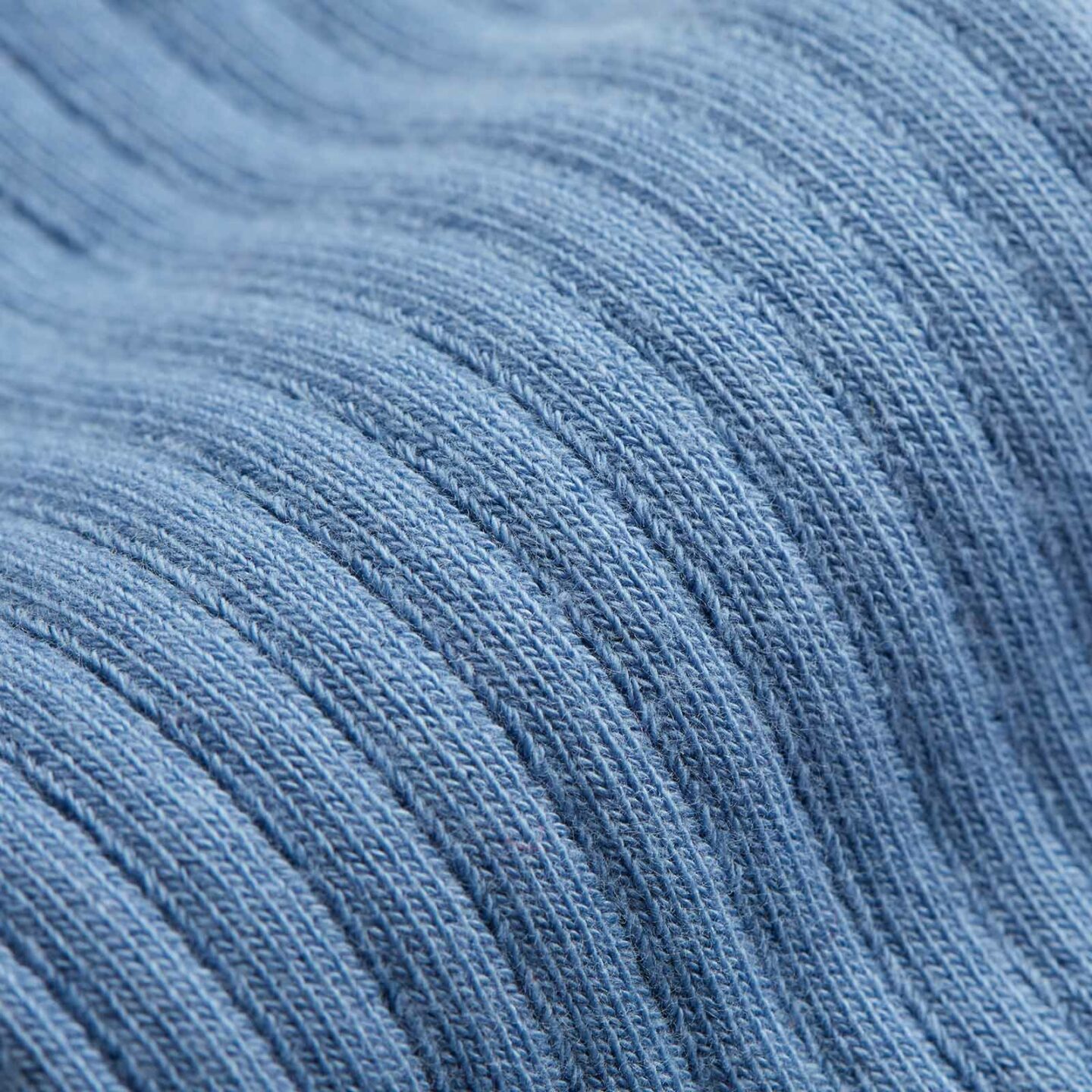 A close up of a blue socks pattern