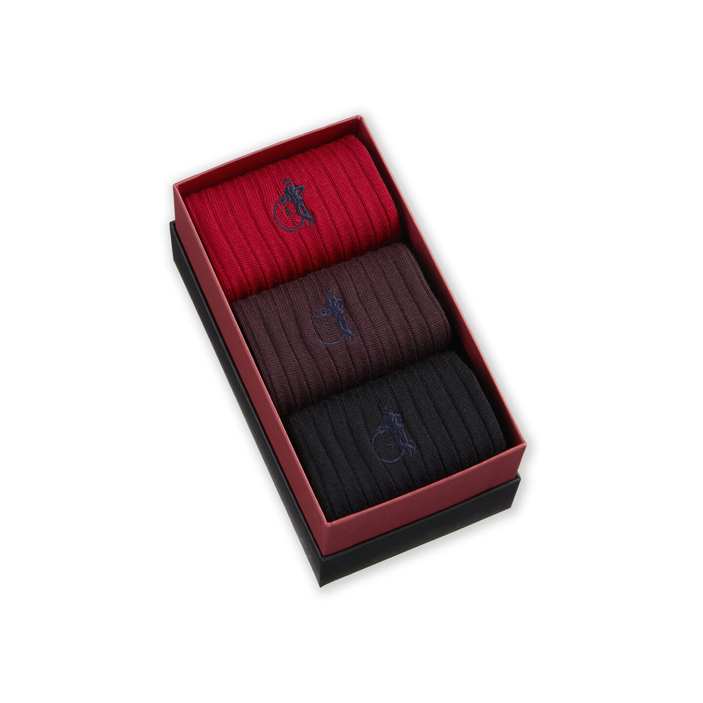 Trio of red, brown and black socks in a box