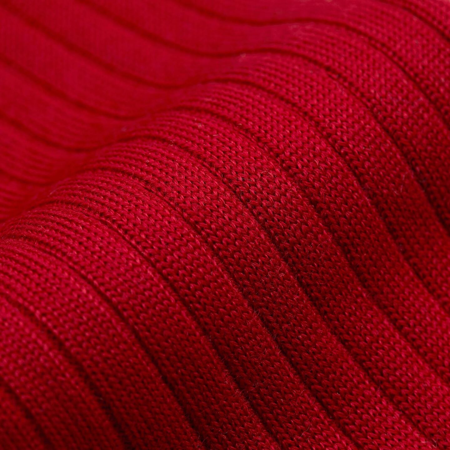 A close up of a pair of red socks